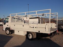 Material Hauling Flatbed Truck with a welder